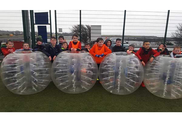 Groups of kids after a Bubble Football Birthday Party