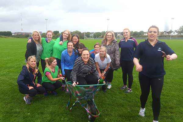 Group ladies on Hen Party with the Hen in a wheel barrow!