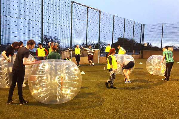 A group of players getting ready to play Bubble Football in one of Astrobay's cages.