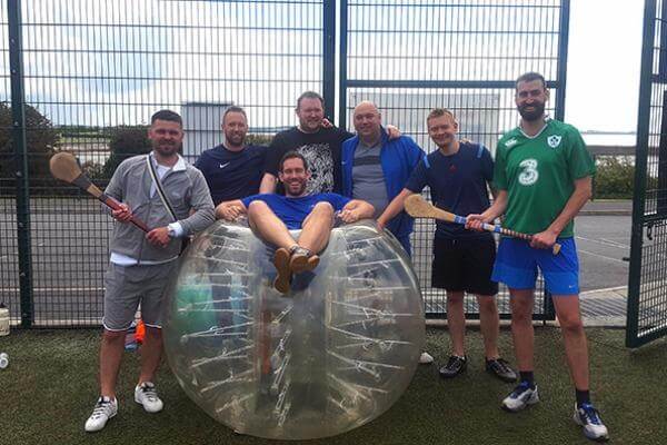 Stag group pose for photo after Bubble Football