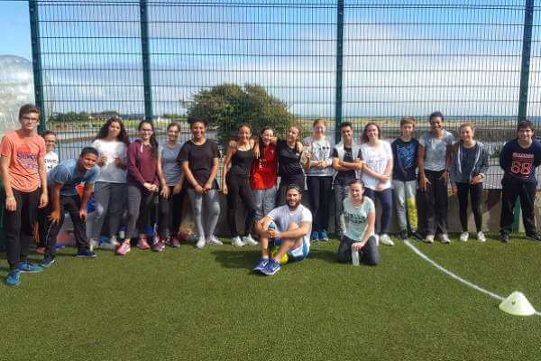 Group of students after Bubble Football pose for photo.